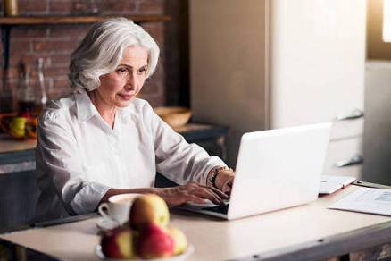 You got mail Granny writing message to her grandchildren through the Internet
